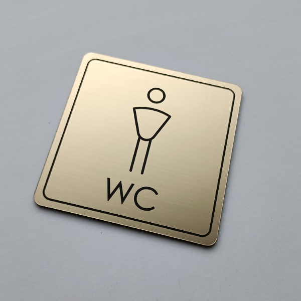 zlatý piktogram WC muži